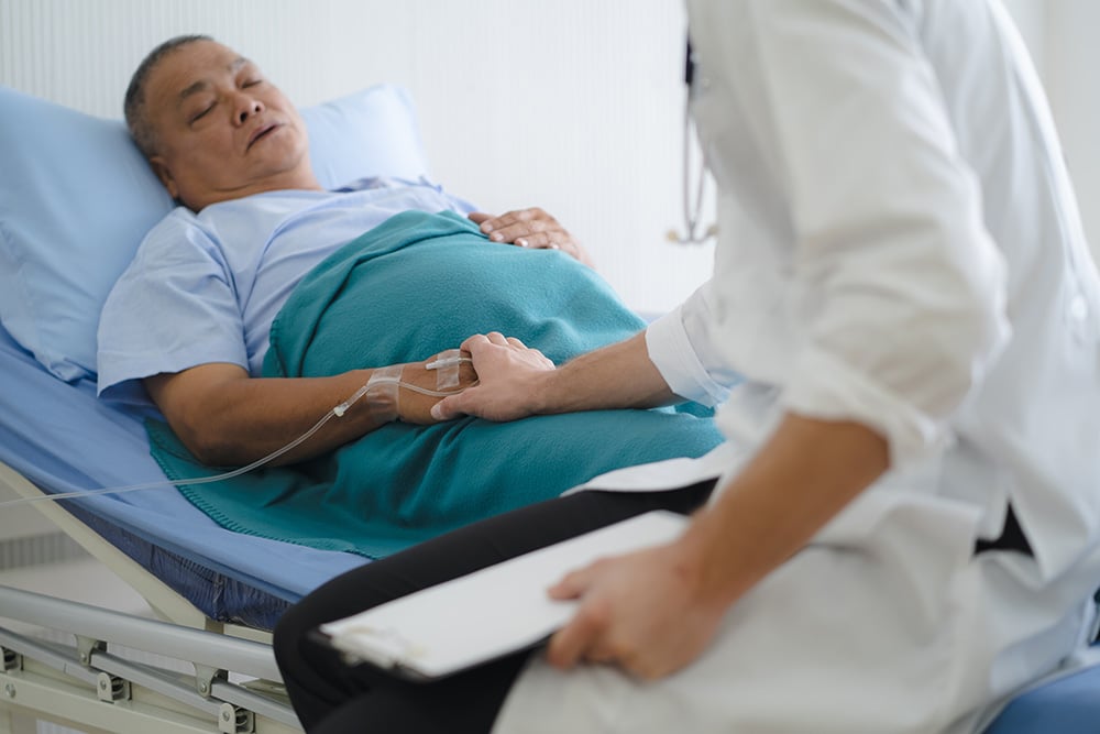A compassionate nurse at american care gently holding an elderly patient's hand, providing comfort and support in a warm and caring medical environment.